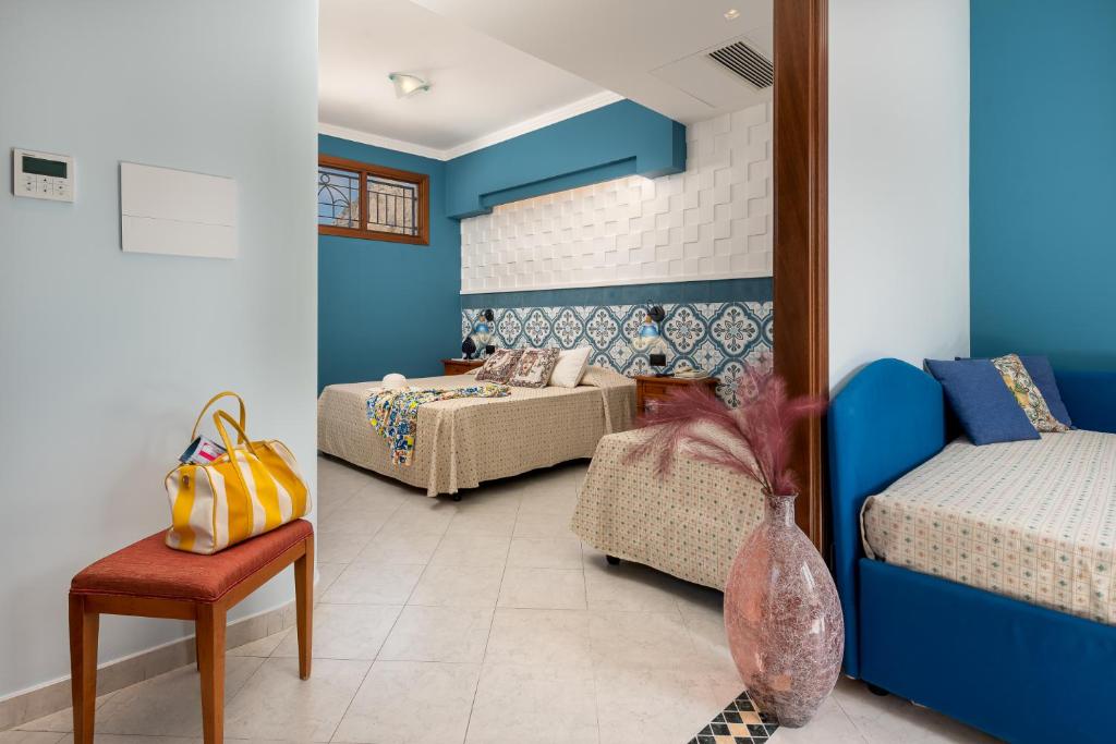 Posteľ alebo postele v izbe v ubytovaní Hotel Sicilya