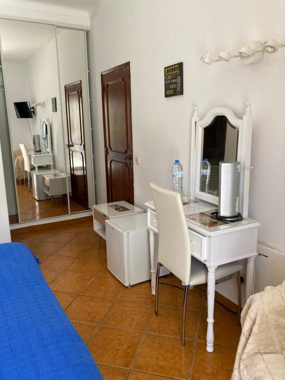 TV a/nebo společenská místnost v ubytování Residencia Julio