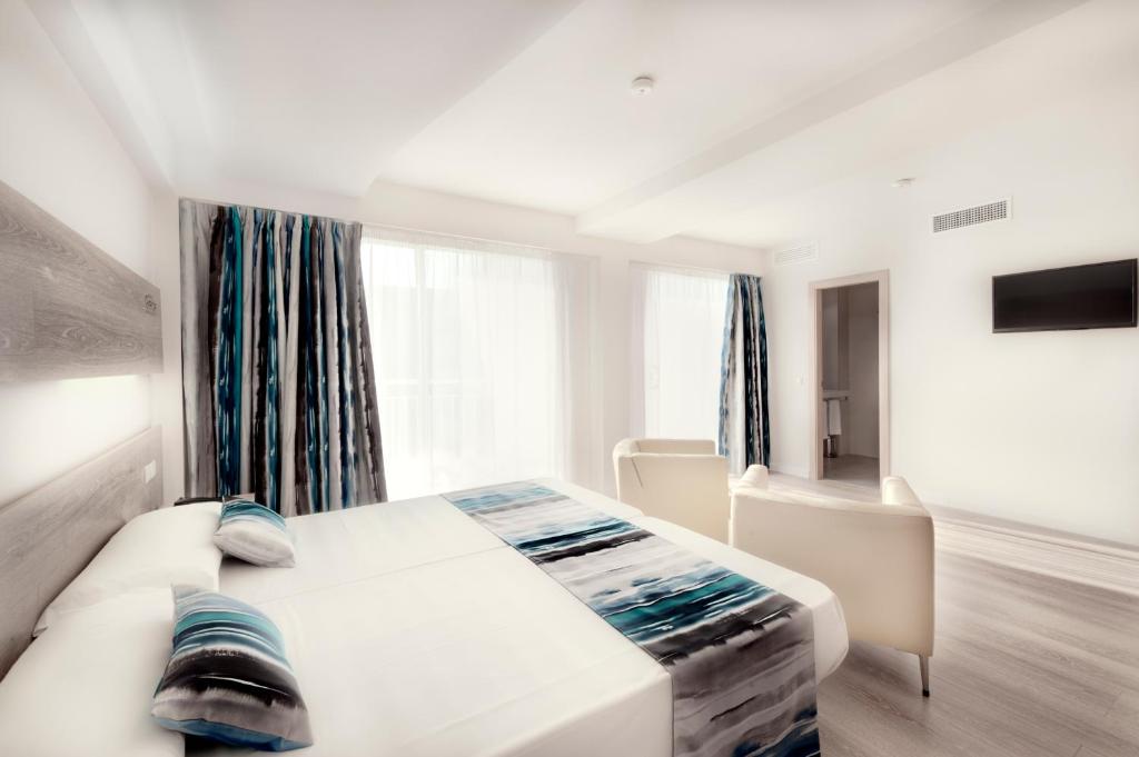 Postel nebo postele na pokoji v ubytování Hotel Gracia
