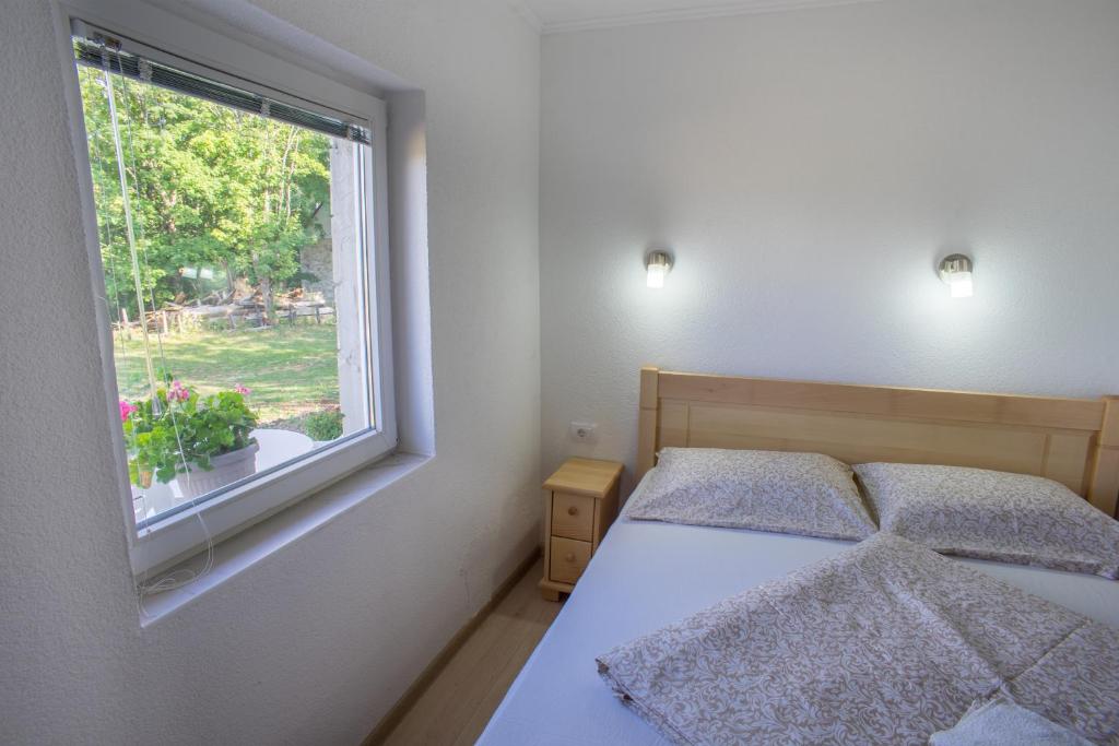 Postel nebo postele na pokoji v ubytování Apartments Stevovic