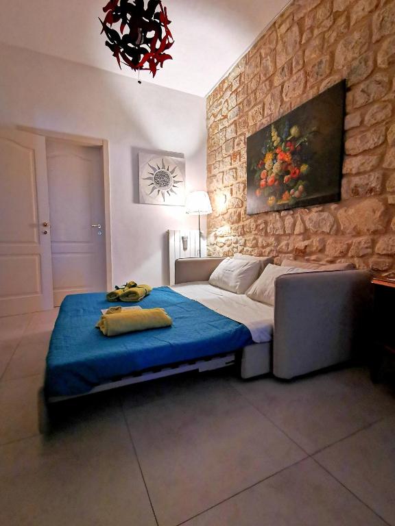 Posteľ alebo postele v izbe v ubytovaní Casa Vacanze Le Giuseppine