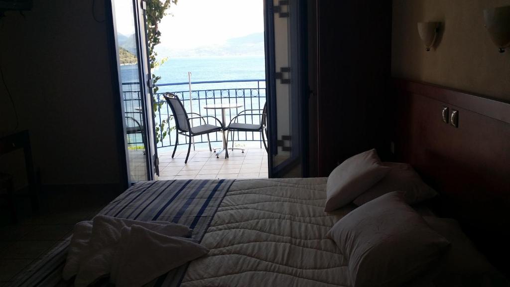 Postel nebo postele na pokoji v ubytování Olive Bay Hotel