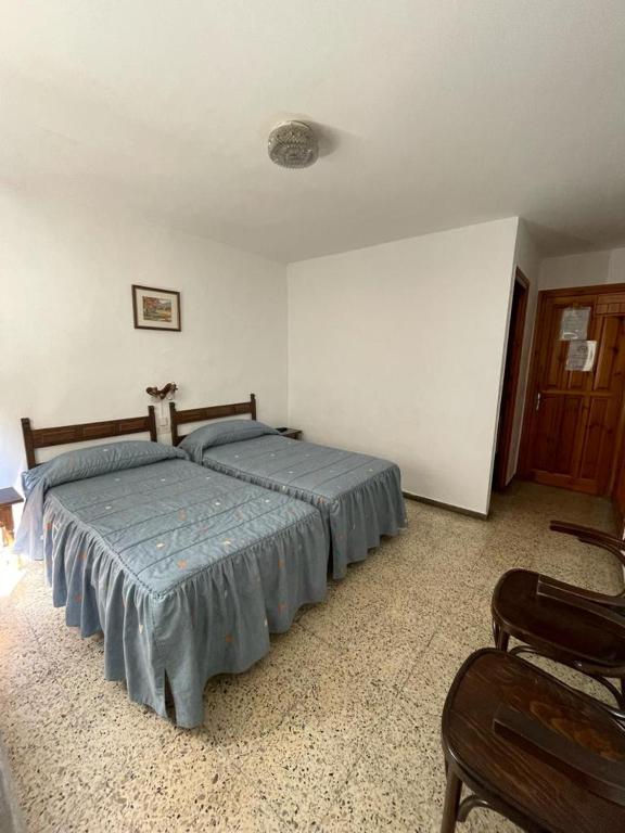 Postel nebo postele na pokoji v ubytování Hostal Ter