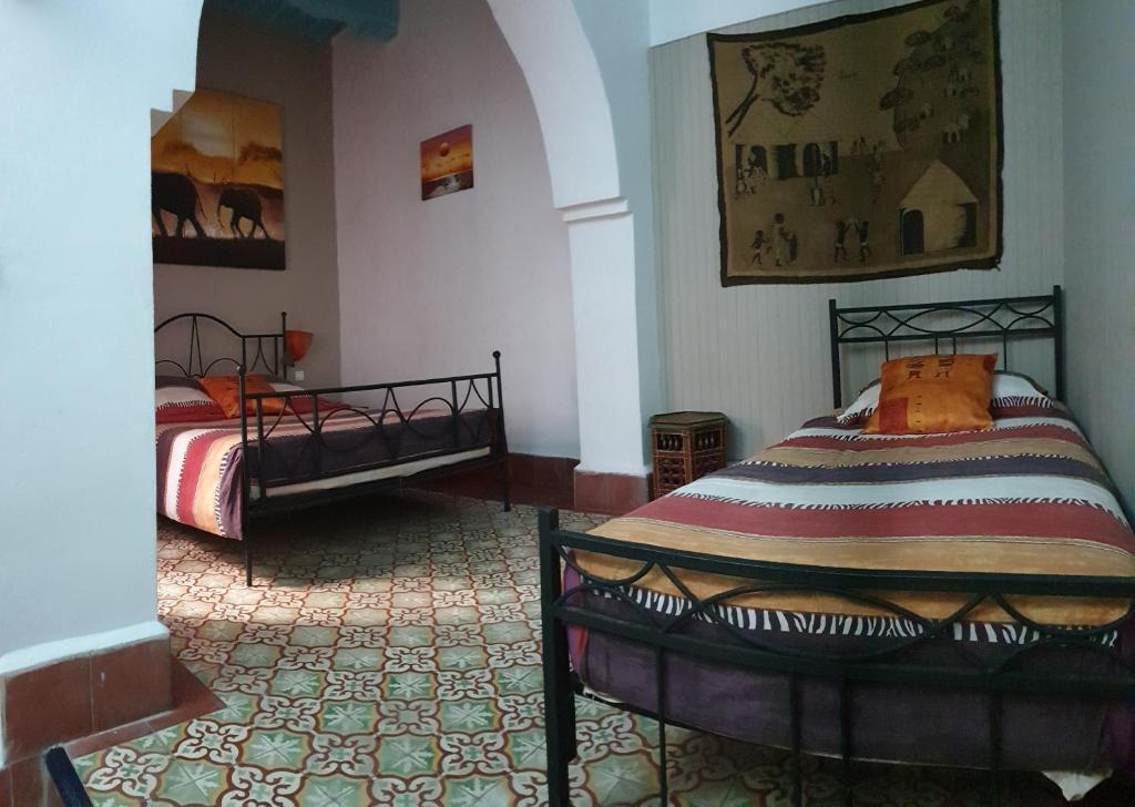 Postel nebo postele na pokoji v ubytování Riad Sidi Magdoul