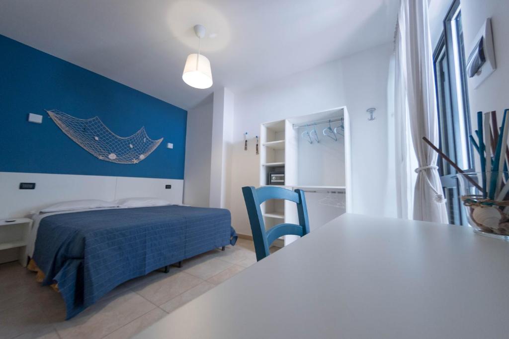Postel nebo postele na pokoji v ubytování La Fenice rooms