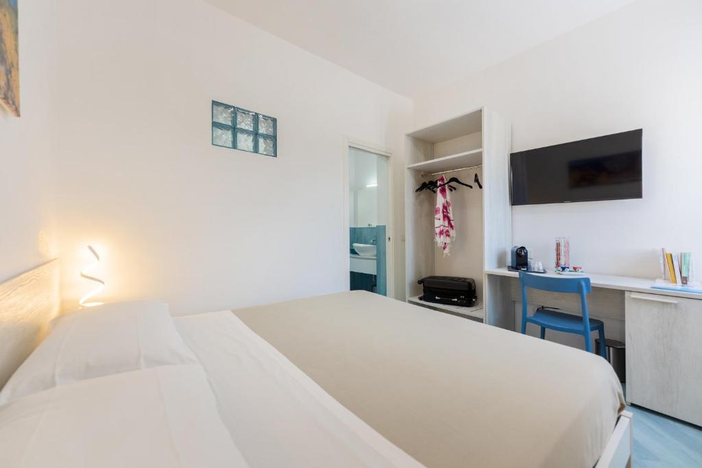 Postel nebo postele na pokoji v ubytování Poseidonia Rooms