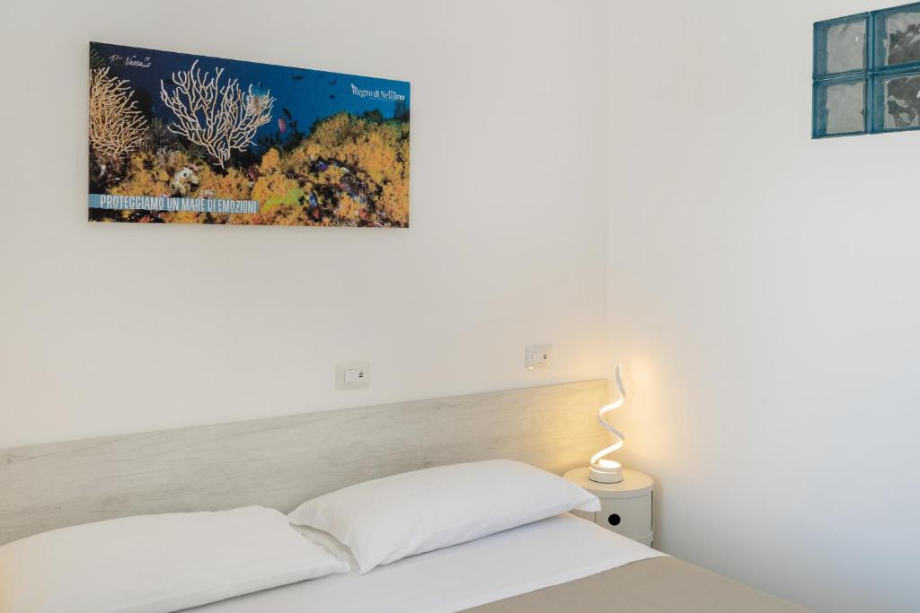 Postel nebo postele na pokoji v ubytování Poseidonia Rooms