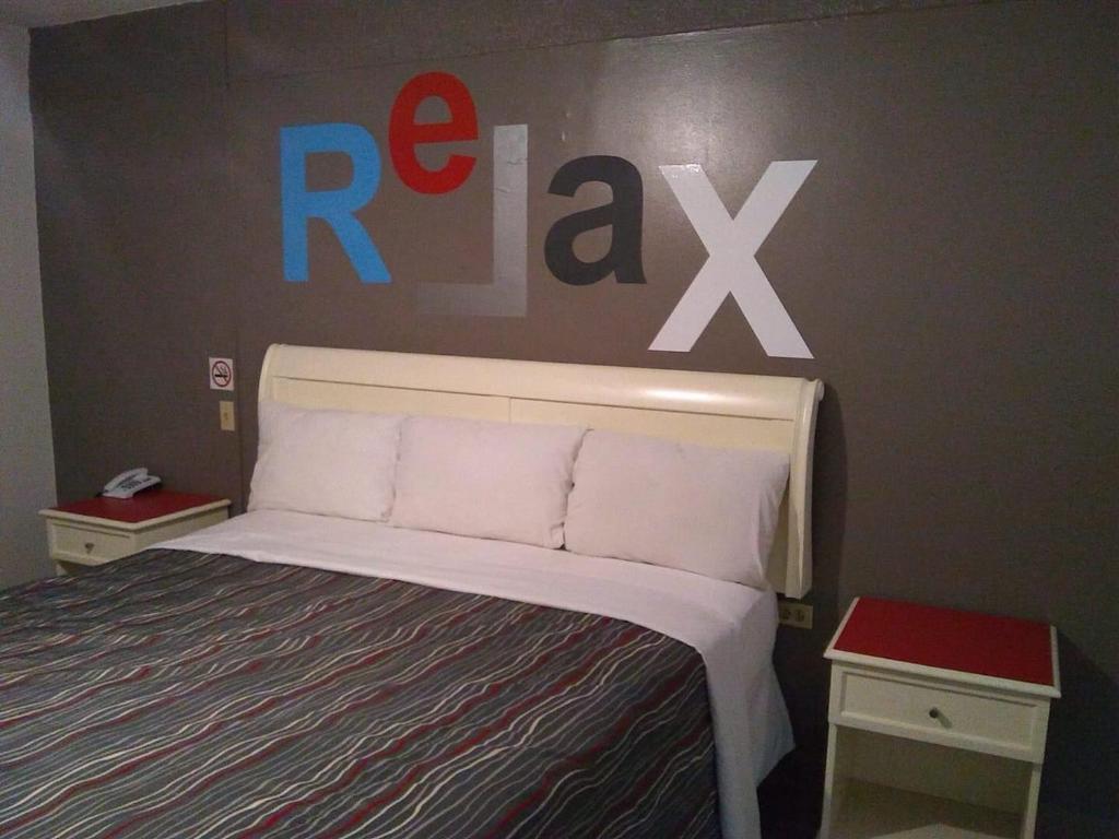 Postel nebo postele na pokoji v ubytování Hotel Boulevard Mexicali