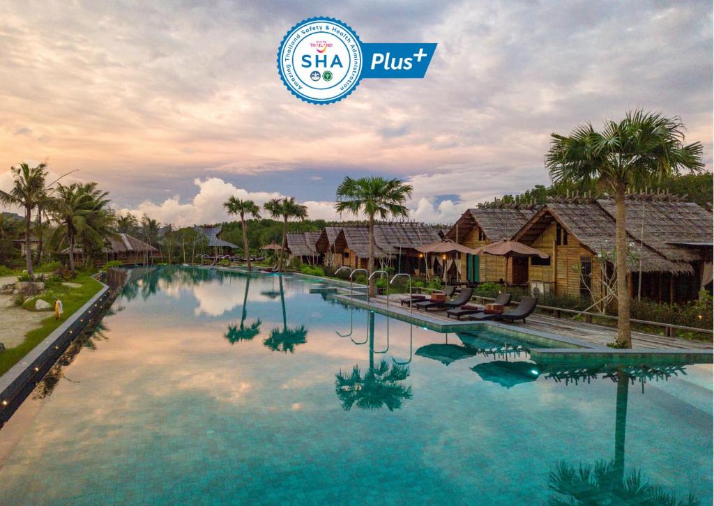 a swimming pool in front of a resort at Venice Krabi Villa Resort in Ao Nam Mao