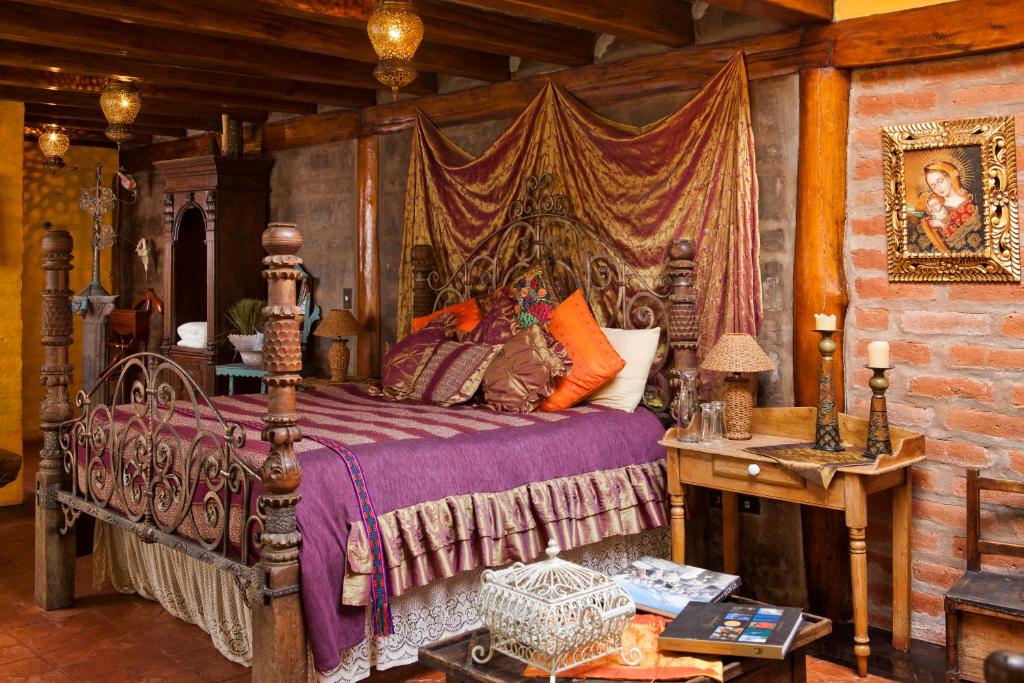 Postel nebo postele na pokoji v ubytování Hacienda Rumiloma