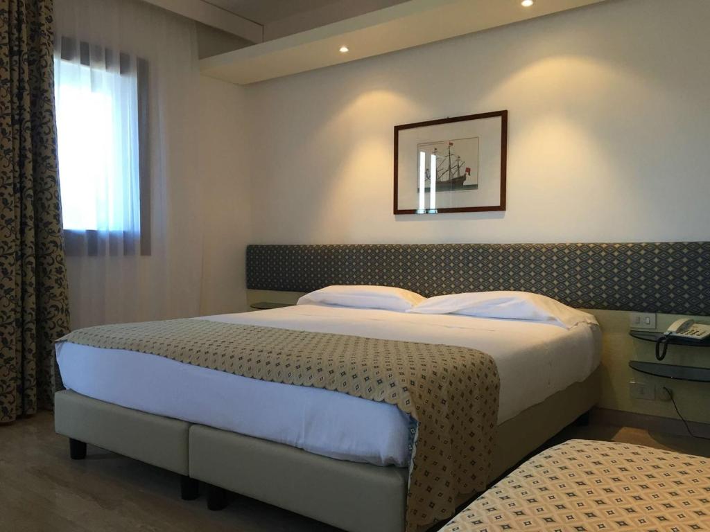 Postel nebo postele na pokoji v ubytování Resort Le Picchiaie