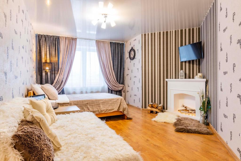 Cama o camas de una habitación en Апартаменты Гостиный Дворъ и Ко Автовокзал