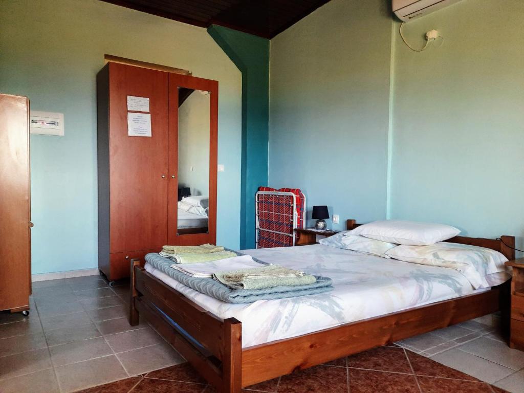 Postel nebo postele na pokoji v ubytování Galaxy Rooms