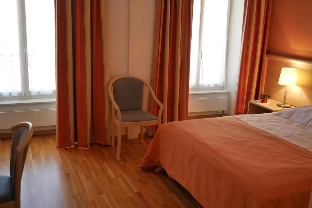 Postel nebo postele na pokoji v ubytování Auberge Aux Deux Sapins