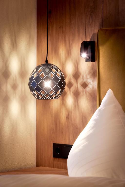 Postel nebo postele na pokoji v ubytování Hotel Margit