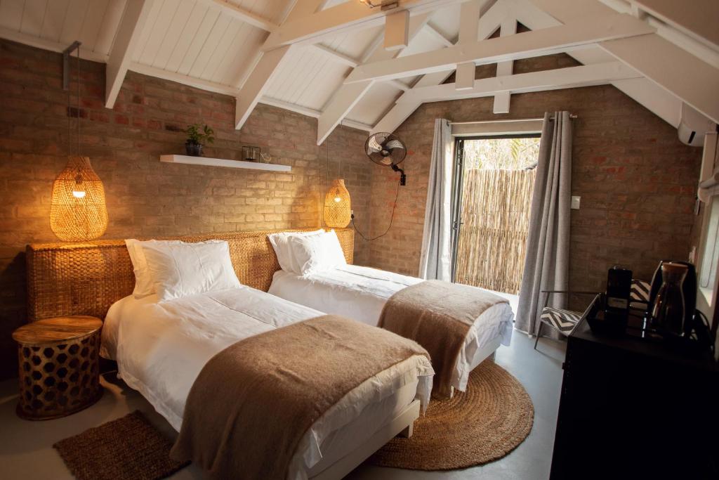Ліжко або ліжка в номері Blaauw Cottage