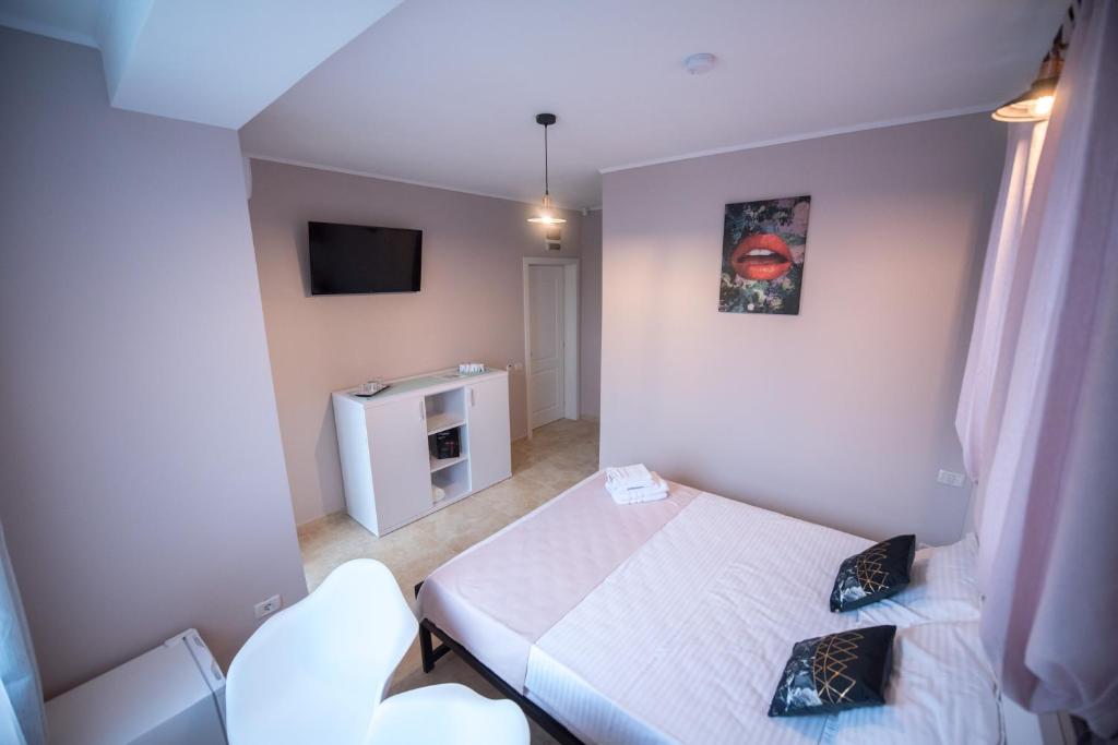 Postel nebo postele na pokoji v ubytování Casa 1A