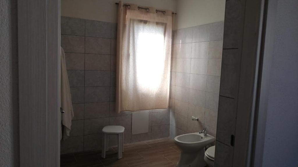 Łazienka w obiekcie Affittacamere Sos Ninnitteddos