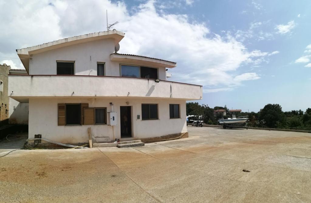 a building with a tower on top of it at B&B Nonno Pino in Maierà