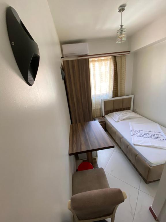 Postel nebo postele na pokoji v ubytování Hotel Heimli