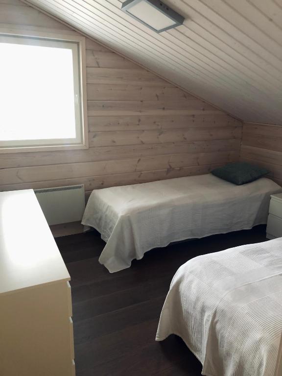 Postel nebo postele na pokoji v ubytování Ylläs Fell Inn