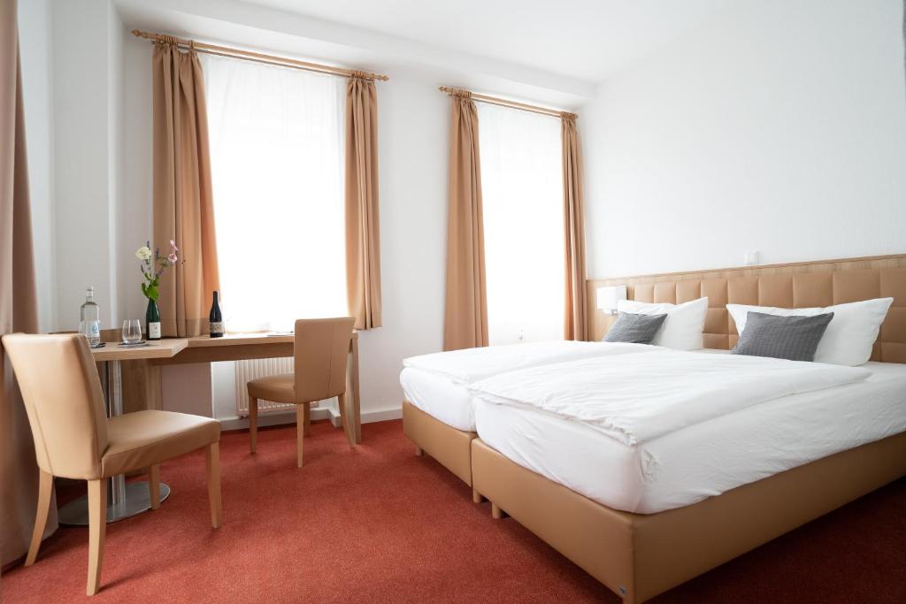 Postel nebo postele na pokoji v ubytování Nineofive Hotel
