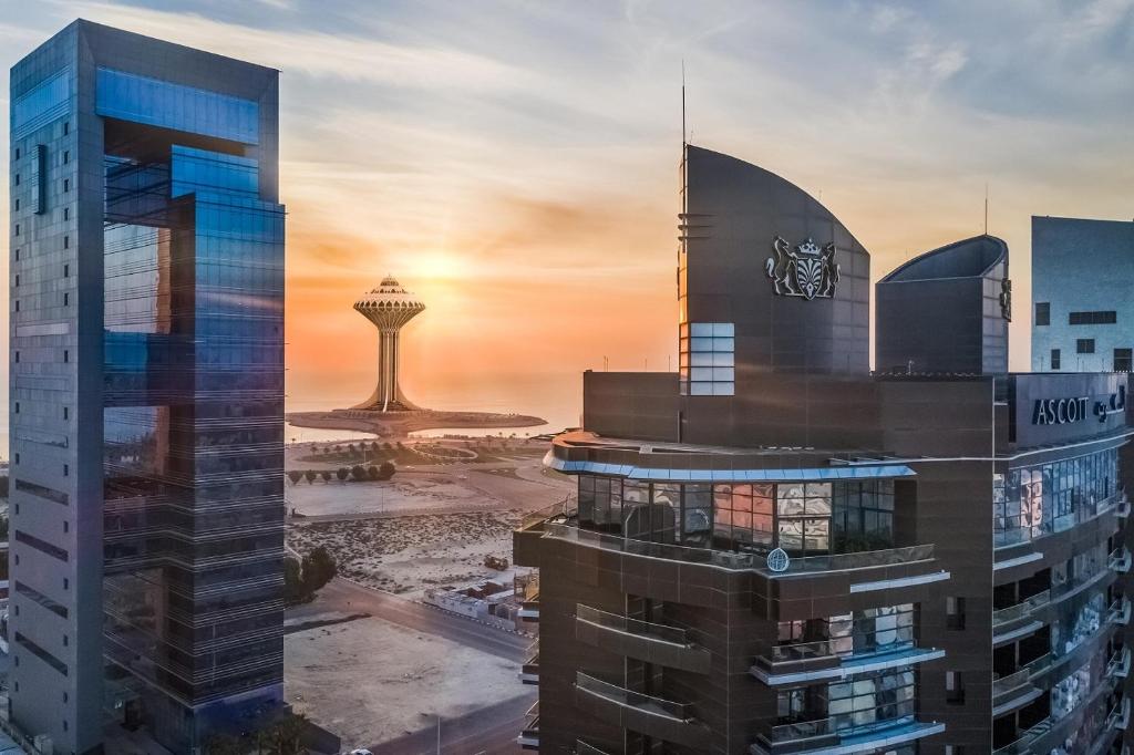 una rappresentazione di una città con una torre sullo sfondo di Ascott Corniche Al Khobar a Al Khobar