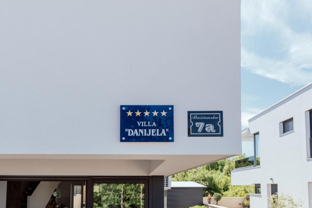 a sign on the side of a building at Villa Danijela in Malinska