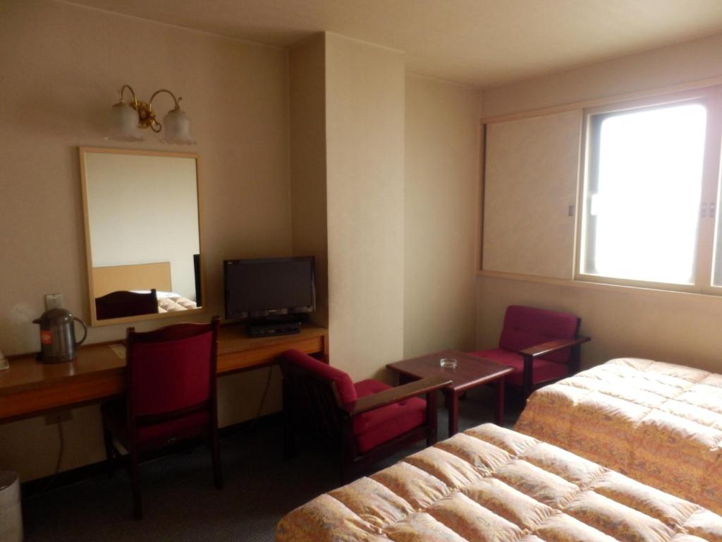 TV a/nebo společenská místnost v ubytování Oka Hotel
