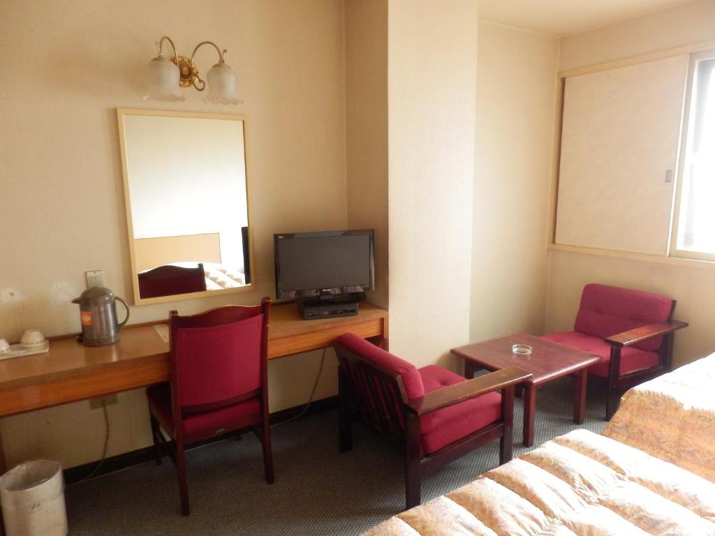 TV a/nebo společenská místnost v ubytování Oka Hotel