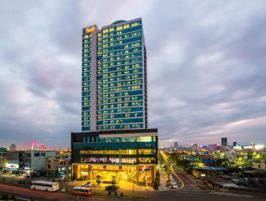 a tall building in a city at night at Muong Thanh Grand Da Nang Hotel in Da Nang