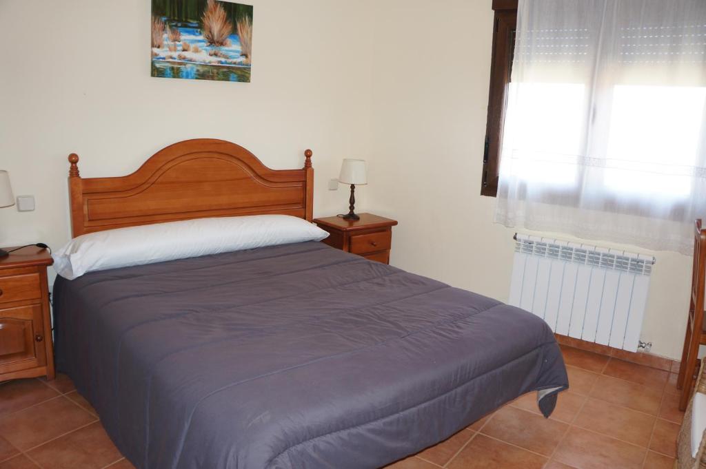 Posteľ alebo postele v izbe v ubytovaní APARTAMENTOS LAS ERAS