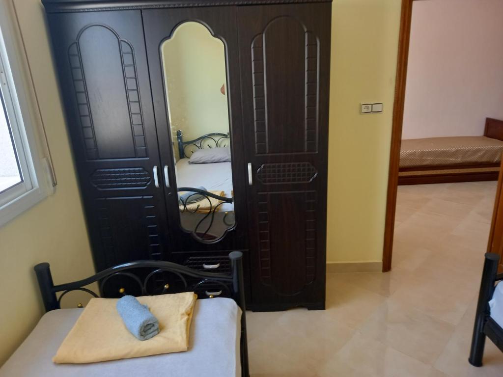 Postel nebo postele na pokoji v ubytování Nieuwbouw appartementen al hoceima