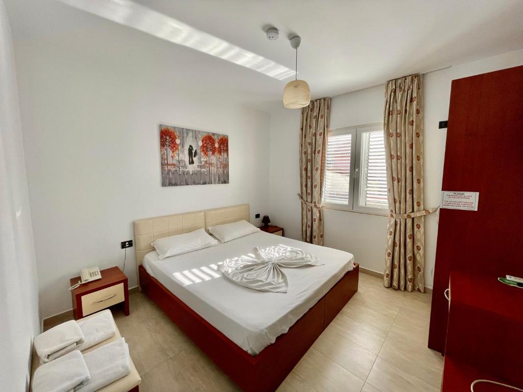 Postel nebo postele na pokoji v ubytování Vila Ada Hotel