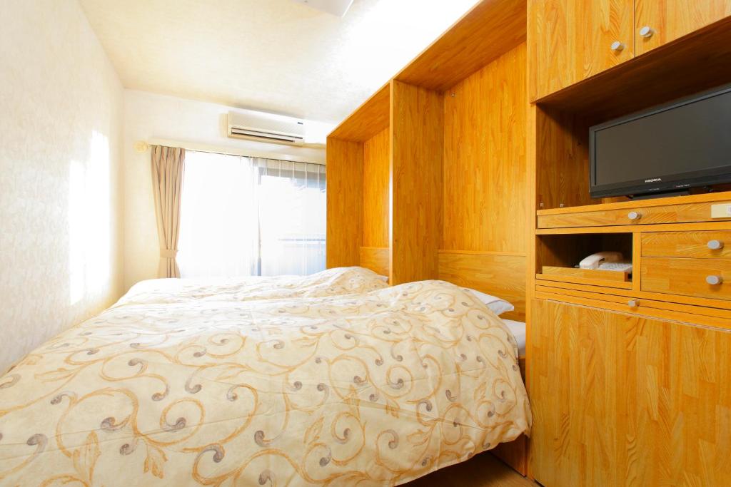 Postel nebo postele na pokoji v ubytování FLEXSTAY INN Nakanobu