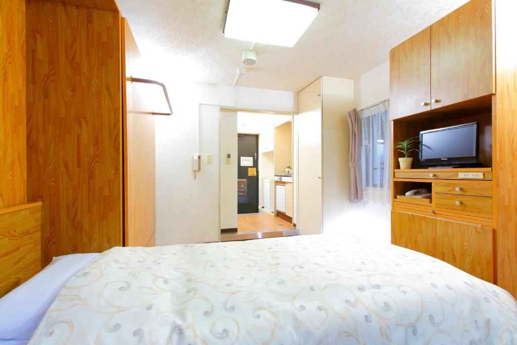 Postel nebo postele na pokoji v ubytování FLEXSTAY INN Nakanobu