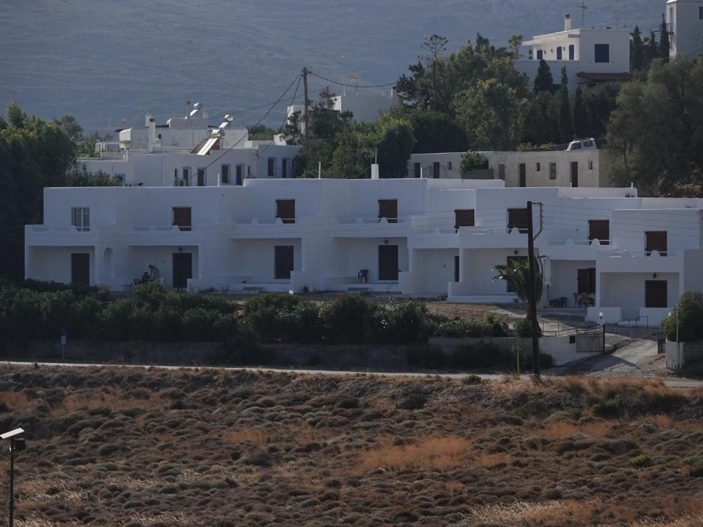 a white building in the middle of a field at EL.DO.SO in Gavrio