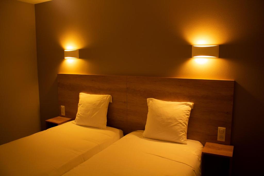 Postel nebo postele na pokoji v ubytování Hotel Marinet