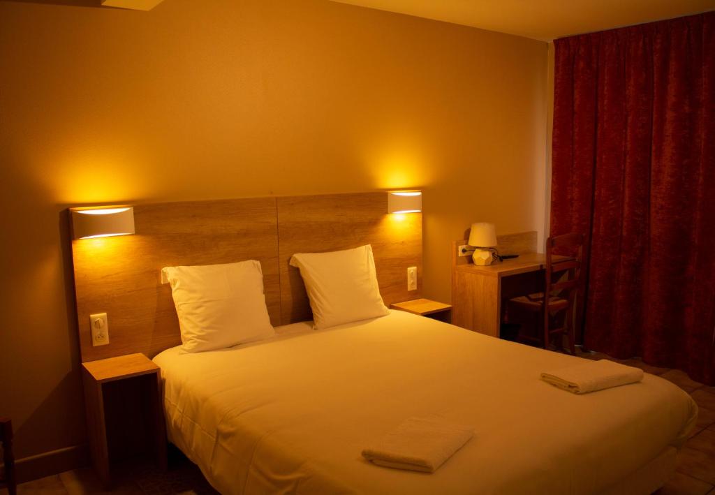 Postel nebo postele na pokoji v ubytování Hotel Marinet
