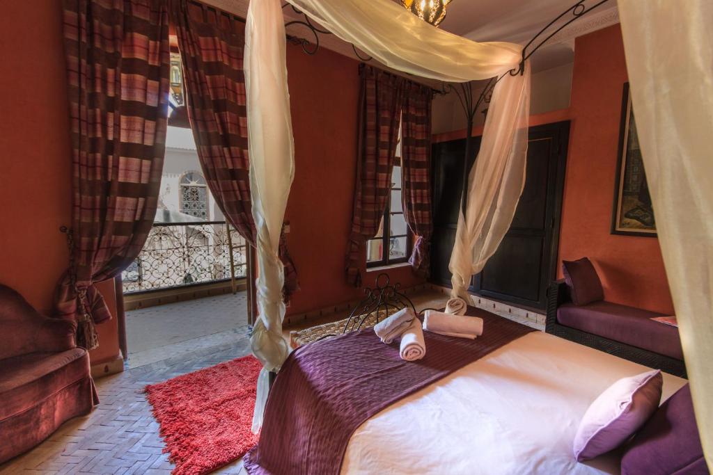 Postel nebo postele na pokoji v ubytování Riad Nabila