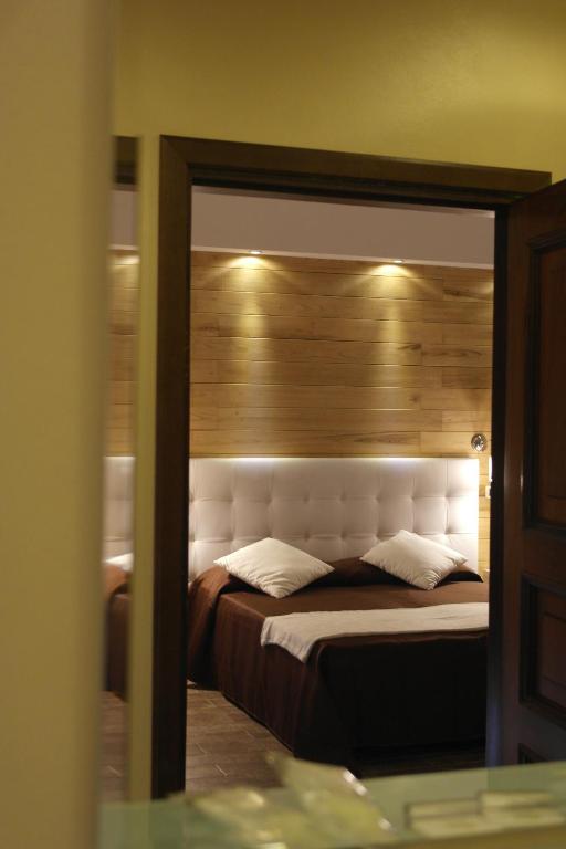 Postel nebo postele na pokoji v ubytování Piccolo Hotel Aurora