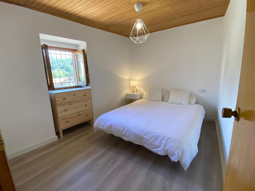 Posteľ alebo postele v izbe v ubytovaní Apartamento rural Meaus