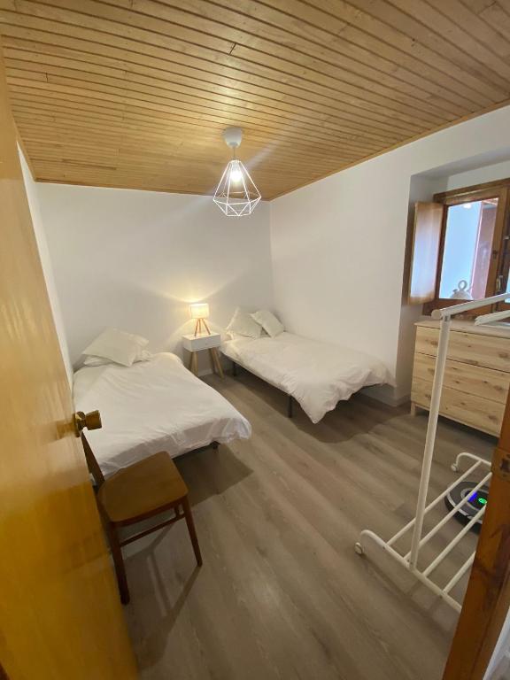 Posteľ alebo postele v izbe v ubytovaní Apartamento rural Meaus