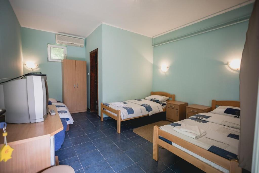 Postel nebo postele na pokoji v ubytování Pool and Villa Splav Dunavac