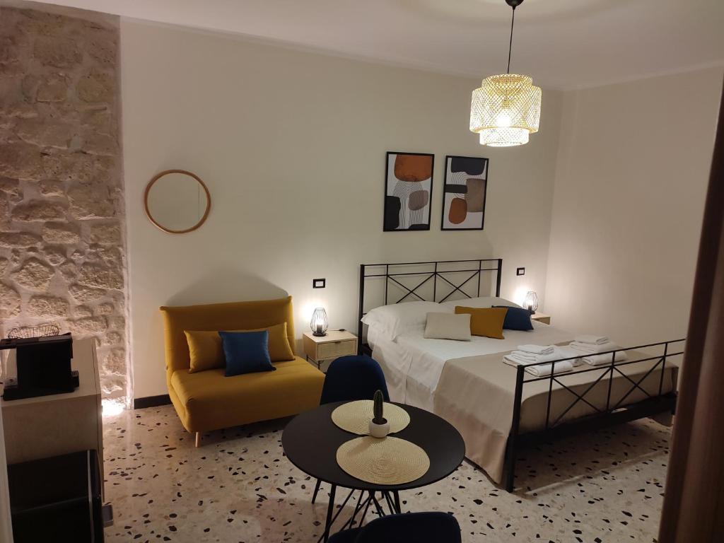 A bed or beds in a room at L'OLIVA CONTESA - la BLU