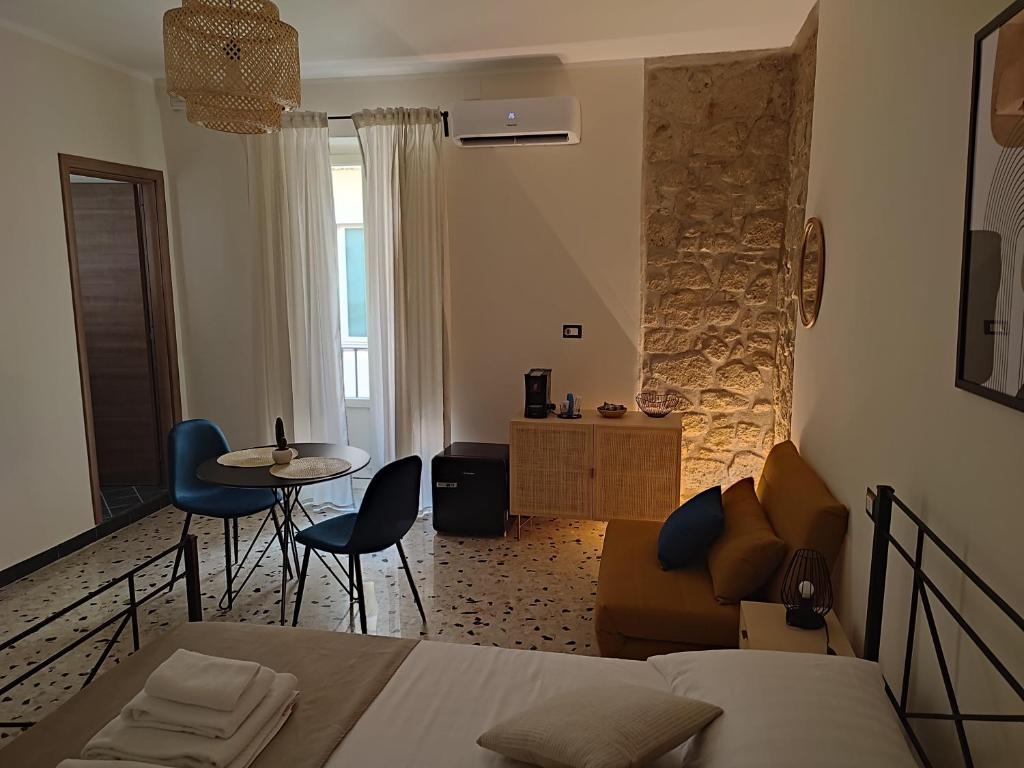A bed or beds in a room at L'OLIVA CONTESA - la BLU