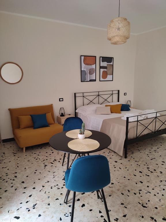 A bed or beds in a room at L'OLIVA CONTESA - la BLU