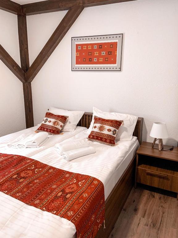 Una cama o camas en una habitación de Apartments HAN Alifakovac-Sarajevo