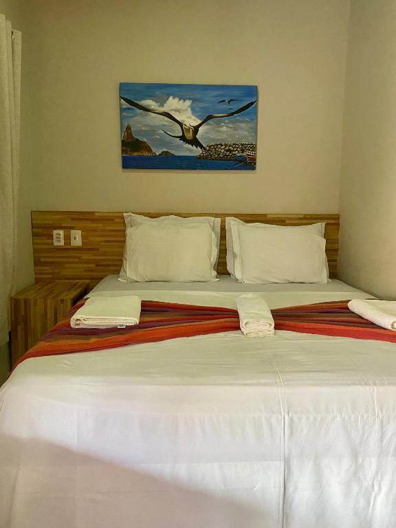 Postel nebo postele na pokoji v ubytování Noronha Good Vibes Hostel