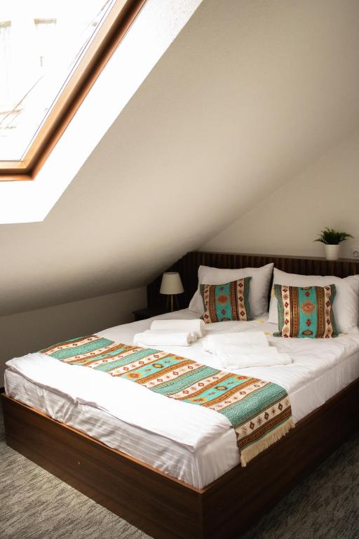 Una cama o camas en una habitación de Apartments HAN Alifakovac-Sarajevo